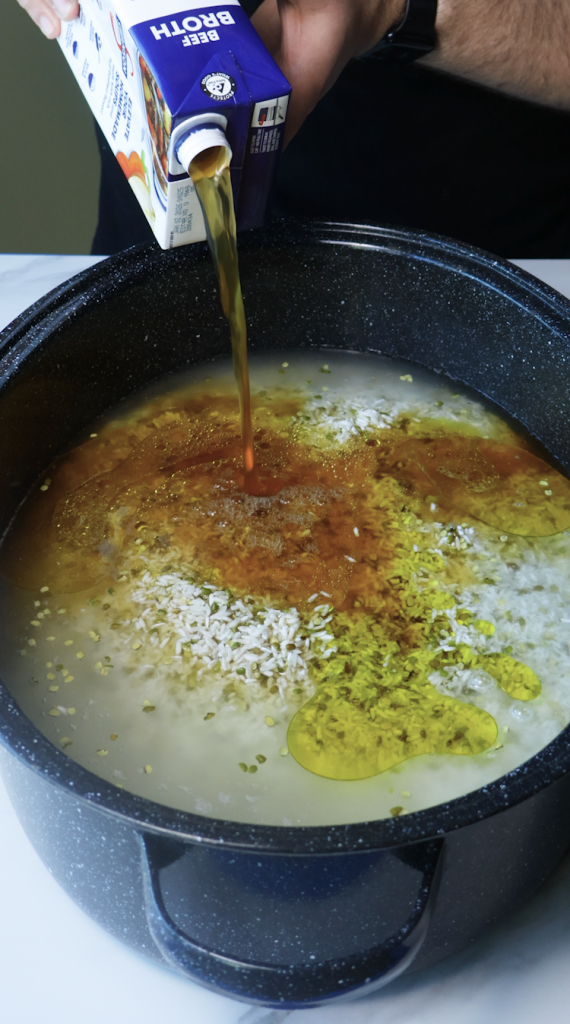 1. Add rinsed rice and mung beans to a large Dutch oven, then add water, beef broth, tomato sauce, oil, chickpeas, seasonings, and cilantro. 